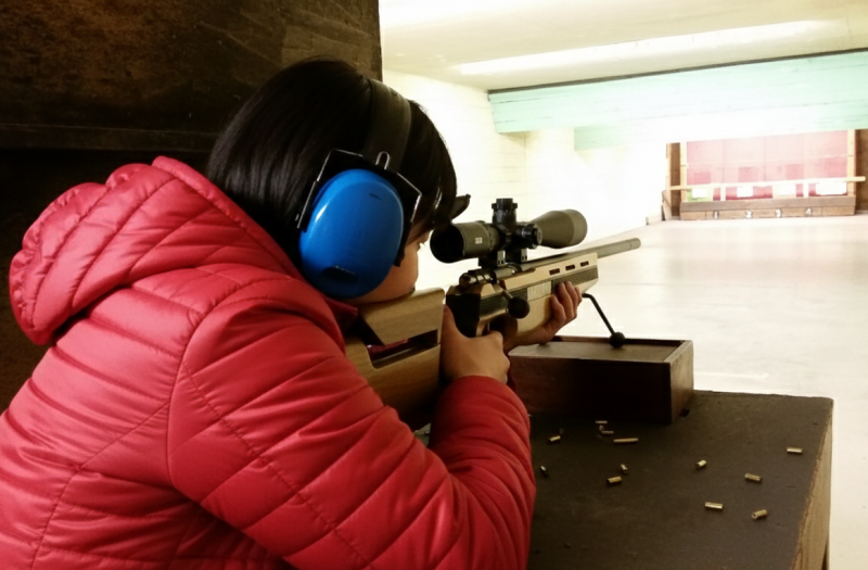 Precision shooting session focusing on firearm safety and handling